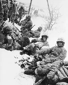 Snowfall Prints: American Marines Rest In Snow In Korea
