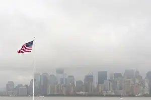 Stefan Auth Travel Photography Prints: American national flag, view from Ellis Island towards the skyline of Manhattan in the fog