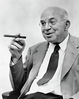 Novelist Prints: American Novelist John Dos Passos Smoking a Cigar