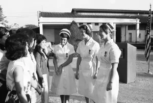 Saigon Prints: American Nurses Being Observed by Vietnamese Girls