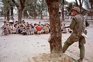 Squatting Prints: American Soldier Guards Refugees in Vietnam