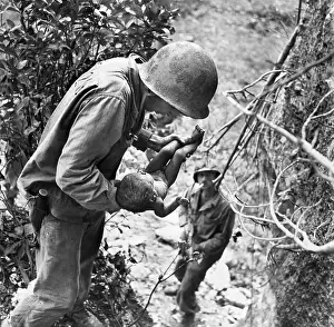 American Soldier Holding Japanese Infant