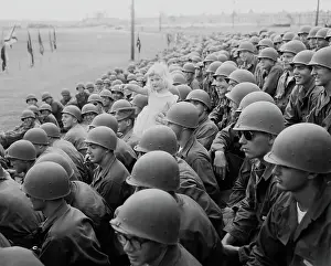 American Soldiers Holding Little Girl During Military Parade