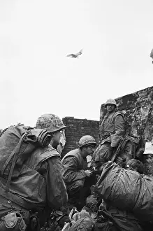 Citadel Prints: American Soldiers Huddled Behind Wall in South Vietnam