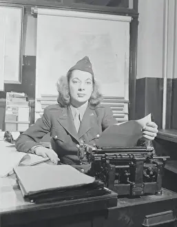 American WAC Reporter at Her Typewriter