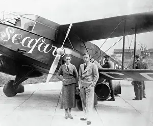 Optimism Prints: Amy and James Mollison Posing by Airplane