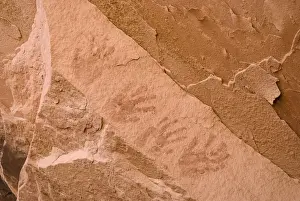 Ancient Indian Handprints On A Red Sandstone Cliff