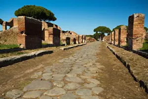 Ruined City Prints: An ancient road in the ruins of the Ancient Roman harbour city of Ostia Antica in Rome