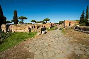 An ancient road in the ruins of the Ancient Roman harbour city of Ostia Antica in Rome, Italy