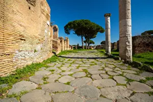 An ancient road in the ruins of the Ancient Roman harbour city of Ostia Antica in Rome, Italy