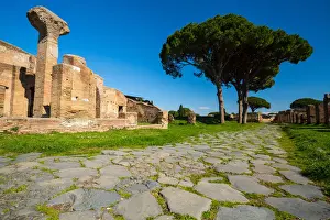 An ancient road in the ruins of the Ancient Roman harbour city of Ostia Antica in Rome, Italy