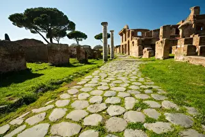 An ancient road in the ruins of the Ancient Roman harbour city of Ostia Antica in Rome, Italy