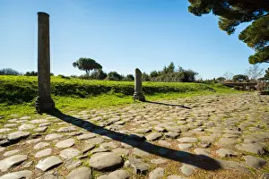 Ruined City Prints: An ancient Roman road in the ruins of the Ancient Roman harbour city of Ostia Antica in Rome