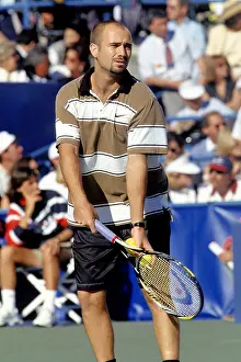 Prints of NEW YORK - CIRCA 1995: Andre Agassi plays tennis during the 1995 US Open in New York City. (Photo by PL Gould/Images Press/Getty Images) The Grand Slam Gallery: Andre Agassi