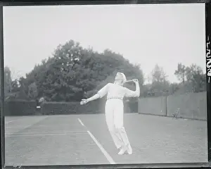 Andre Gobert Serving in Tennis Match