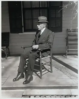 Andrew Mellon Relaxing in Chair