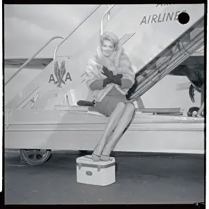 Gangway Prints: Angie Dickinson Sitting at Base of Airplane Steps