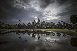 Images Dated 24th August 2013: Angkor Wat temple at dawn reflected in water