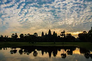 Silhouette Gallery: Angkor Wat temple at sunrise reflecting in water