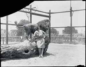 El Monte Prints: Animal Trainer Posing Next to a Lion