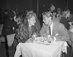 Ann Baxter And Peter Lawford At Table