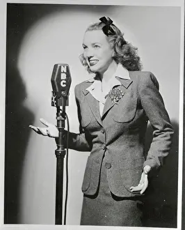 Former Ann Eden Standing at Microphone