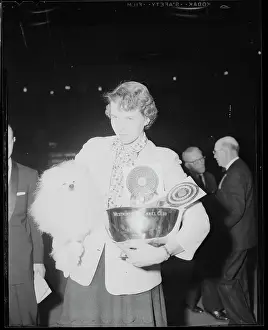 Ann Hone Rogers Carrying a Poodle
