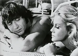 Ann-Margret Kneeling Next to Joe Namath Lying on His Stomach