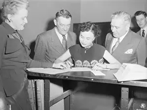 Anna Chennault Signing Naturalization Papers
