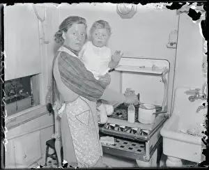 Parenthood Prints: Anna Hauptmann Holding Baby at Stove