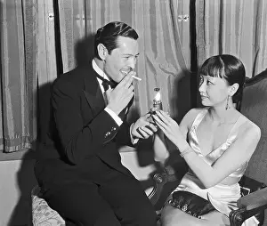 Anna May Wong Assisting with Lighter