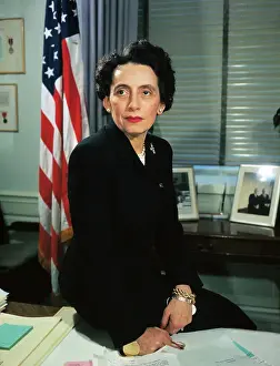 Anna Rosenberg Seated on Desk