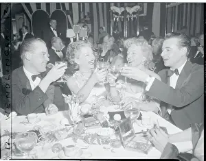 Anne Baxter Sharing a Toast with Colleagues