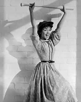 Annette Funicello Holding Baseball Bat over Her Head
