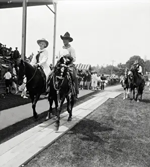 Annie Oakley and Fred Stone Riding into Stadium