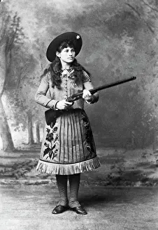 Annie Oakley Holding a Rifle