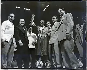Announcer Prints: Announcer Raises Kid Gavilan's Arm