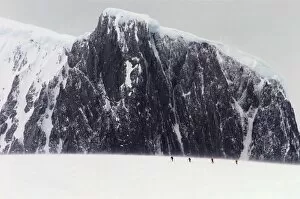 Polar Climate Gallery: Antarctica, Palmer Peninsula, climbers skiing towards mountain, summer