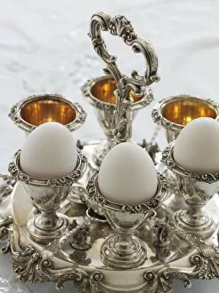 Nourishment Collection: Antique silver egg cups in a sophisticated environment