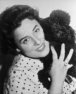 Antonietta Stella Holding Pet Poodle