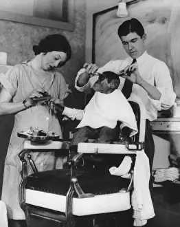 Prints of A young chimpanzee is given a haircut and manicure, circa 1930. (Photo by FPG/Hulton Archive/Getty Images) Black and White Images Capturing the Essence of Mid-20th Century: Ape Pampering