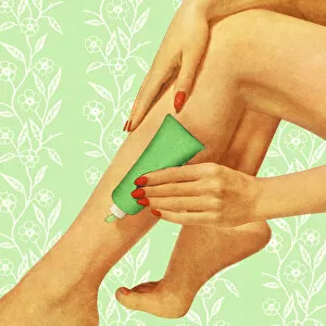 Images Dated 29th August 2013: Applying Lotion to Legs