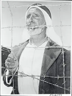 Palestinian Prints: Arab Man Behind a Barbed Wire on Gaza Strip