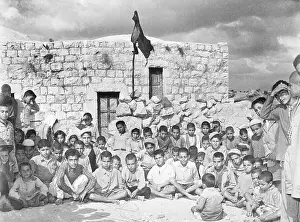 Arab Youths Sitting by Wreckage