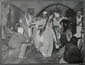 Arabic Men and Women Dancing and Drinking