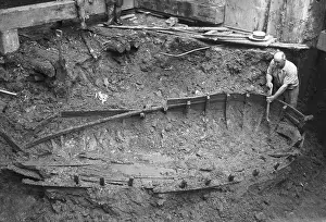 Archaeologist Digging Around Boat