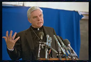 Archbishop Bernard Francis Law Speaking at Microphones