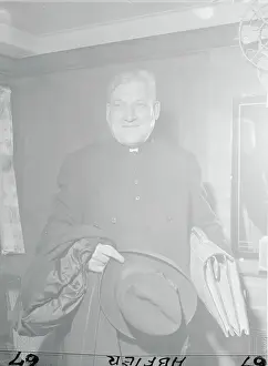 Archbishop Richard J. Cushing Posing with Hat and Coat