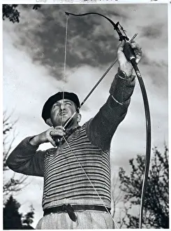 Archer Tom Boland Aiming Bow and Arrow