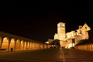 Images Dated 14th November 2015: Arches along Piazza San Francesco at night with Basilica of San Francesco d Assisi in the background